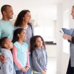 realtor talking to a family